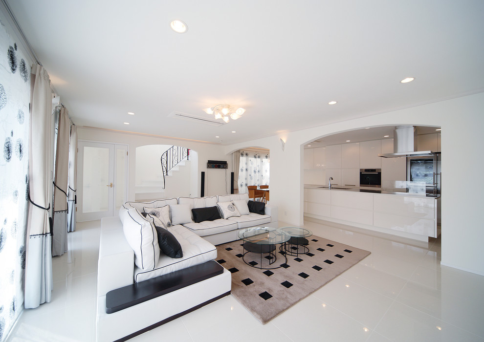 This is an example of a medium sized contemporary formal open plan living room in Yokohama with white walls, ceramic flooring, a freestanding tv and white floors.