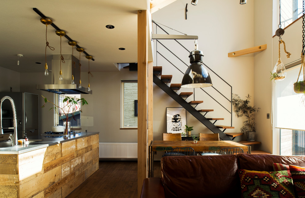 Photo of an urban open plan living room in Sapporo with white walls, medium hardwood flooring and brown floors.