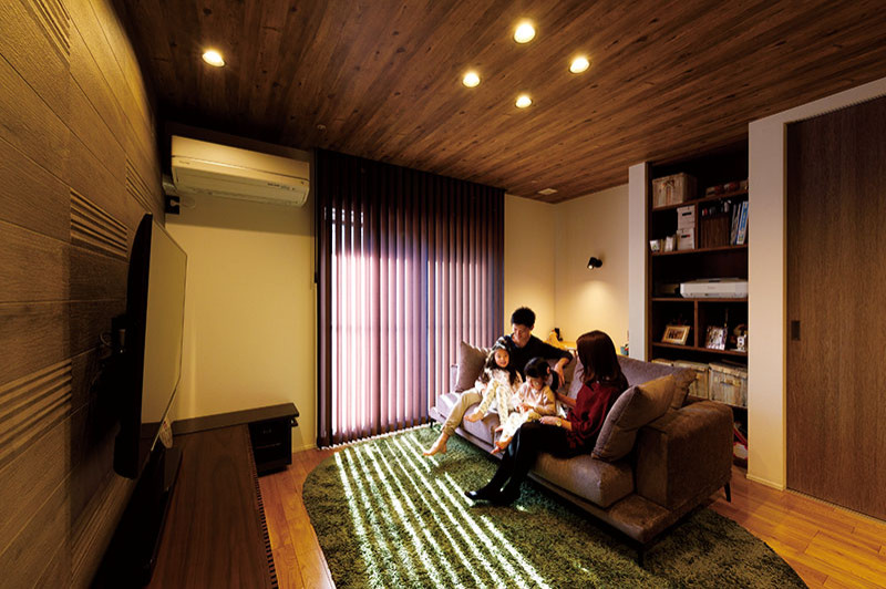 Living room - small modern formal and open concept medium tone wood floor, brown floor, wallpaper ceiling and wallpaper living room idea in Tokyo with beige walls and a wall-mounted tv