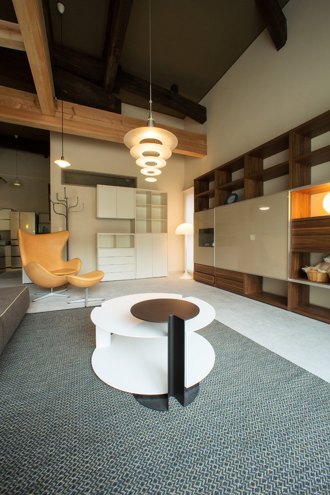 Imagen de salón contemporáneo con paredes beige