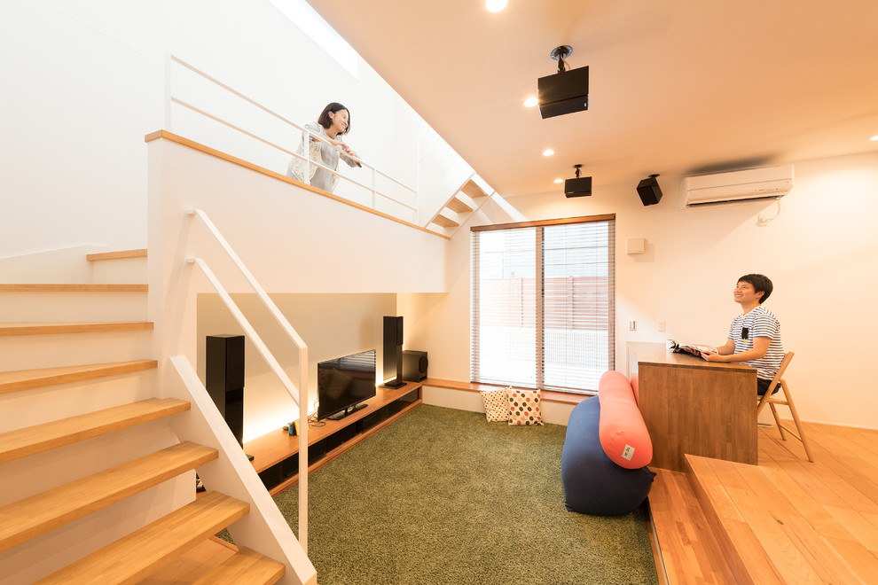 Living room - scandinavian open concept medium tone wood floor and beige floor living room idea in Kyoto with white walls
