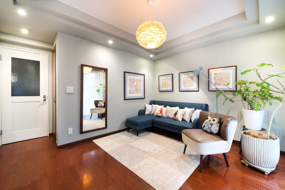 Example of a transitional painted wood floor and brown floor living room design in Nagoya with gray walls