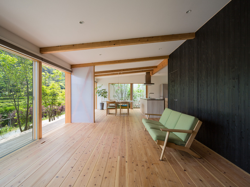 Inspiration for a zen open concept light wood floor and beige floor living room remodel in Fukuoka with multicolored walls