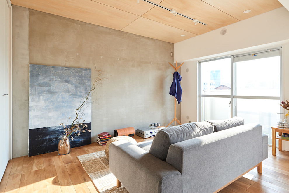 Scandi open plan living room in Other with grey walls, medium hardwood flooring and beige floors.