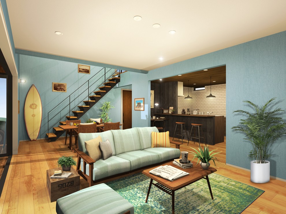Example of a beach style open concept medium tone wood floor and brown floor living room design in Osaka with blue walls