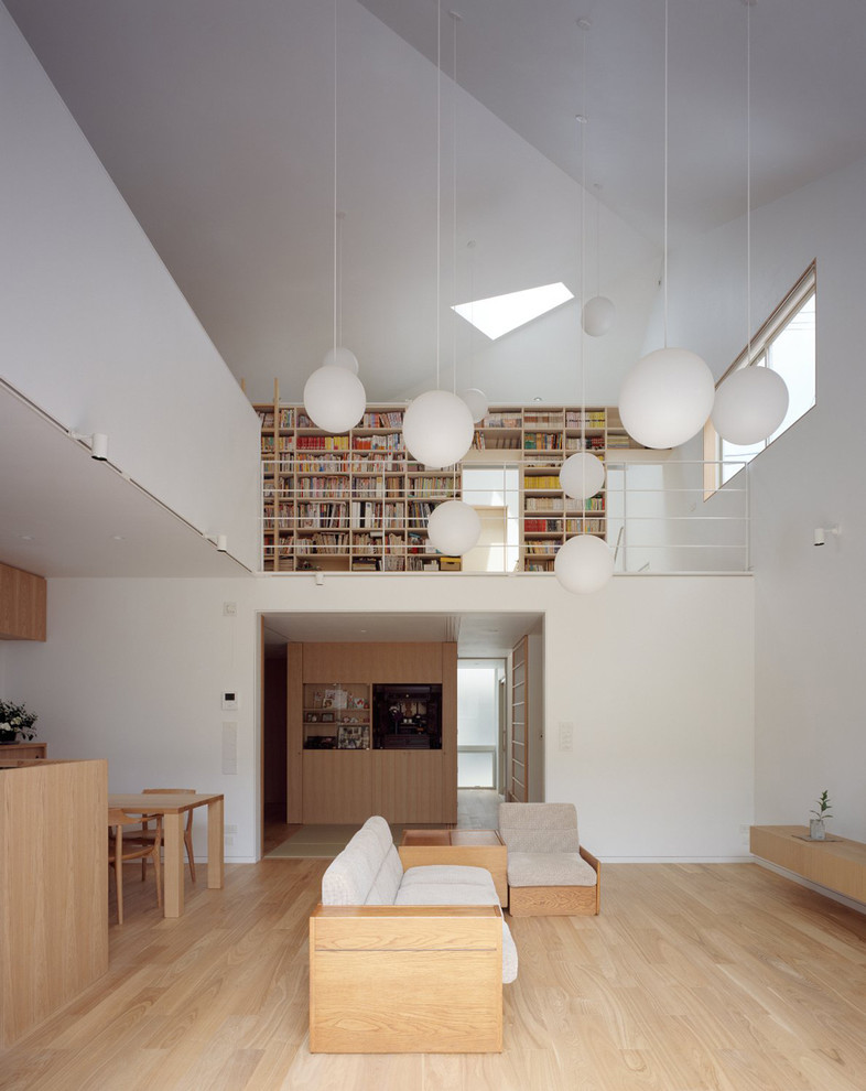 Mid-sized minimalist open concept light wood floor living room photo in Tokyo with white walls, no tv and no fireplace