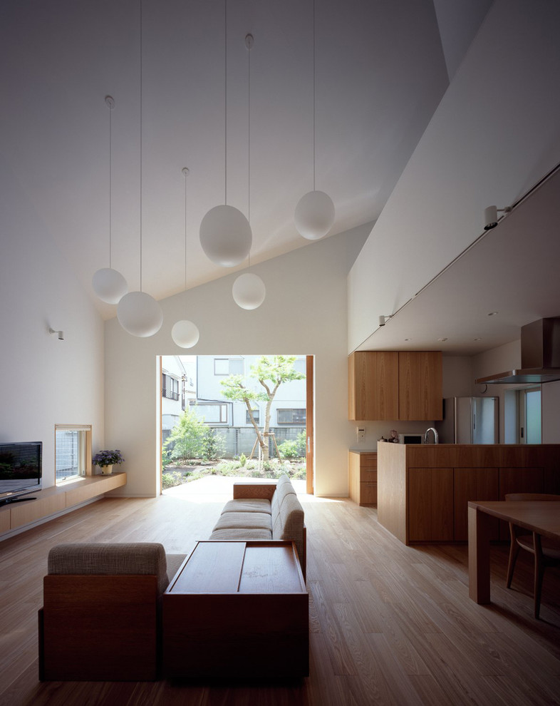 Mid-sized minimalist open concept light wood floor living room photo in Tokyo with white walls, no fireplace and a tv stand
