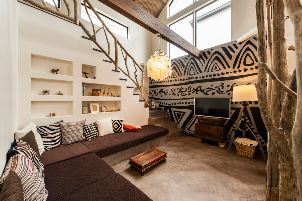 Design ideas for a bohemian living room feature wall in Tokyo with white walls, a wall mounted tv and grey floors.