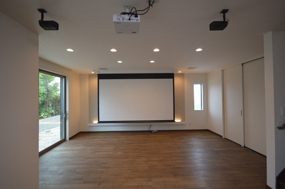 Inspiration for a shabby-chic style dark wood floor and brown floor living room remodel in Fukuoka with white walls and a wall-mounted tv