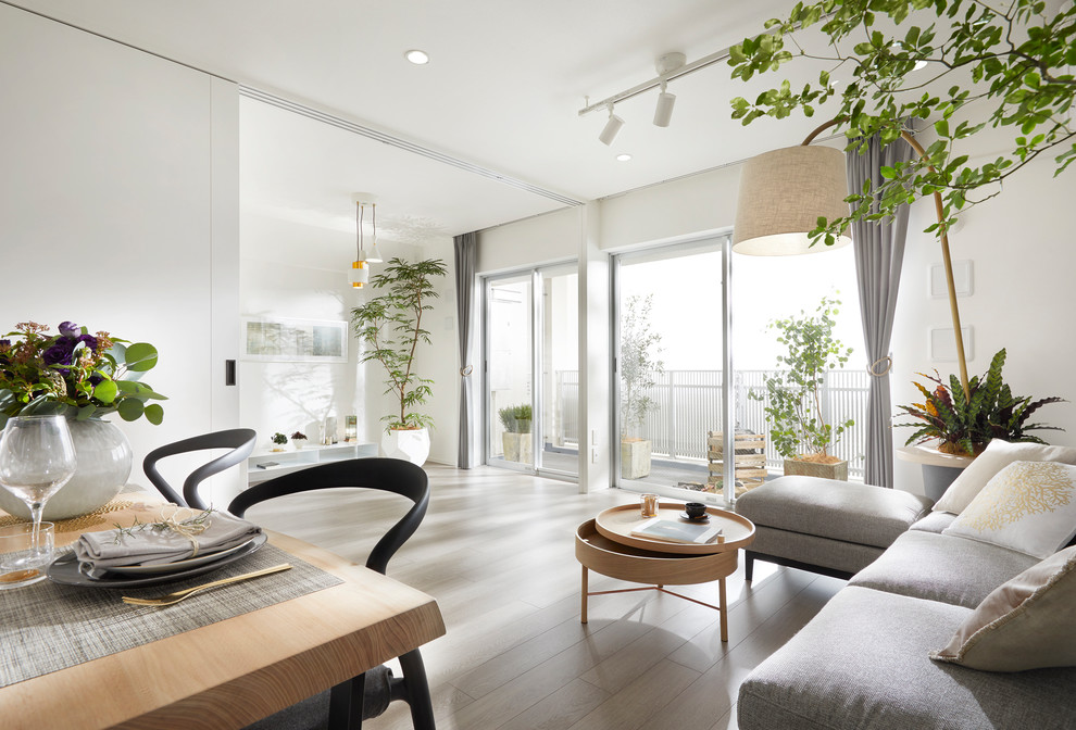 Design ideas for a contemporary living room in Tokyo with white walls, painted wood flooring and grey floors.