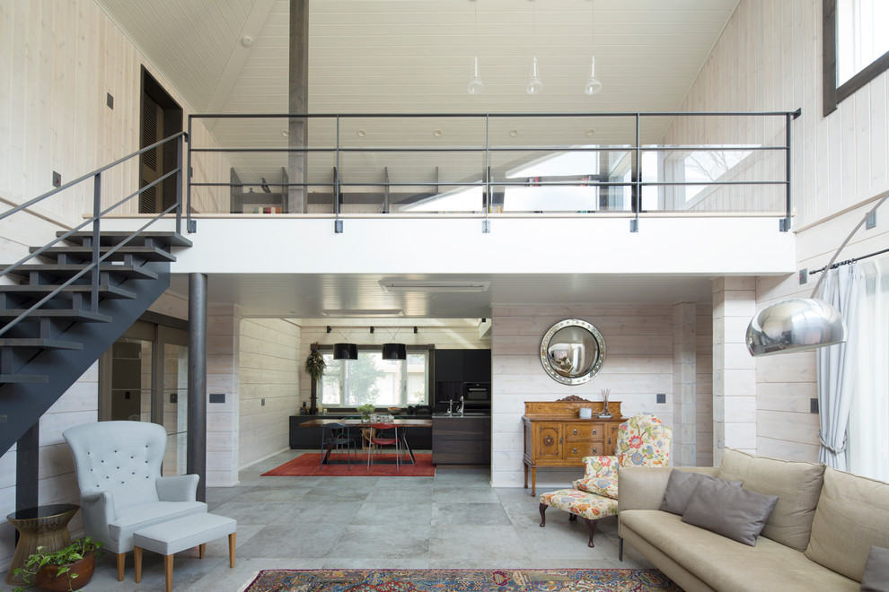 Esempio di un soggiorno minimalista con pavimento grigio