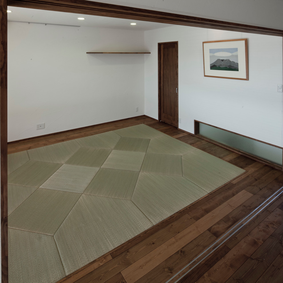 Immagine di un soggiorno etnico con pavimento in tatami