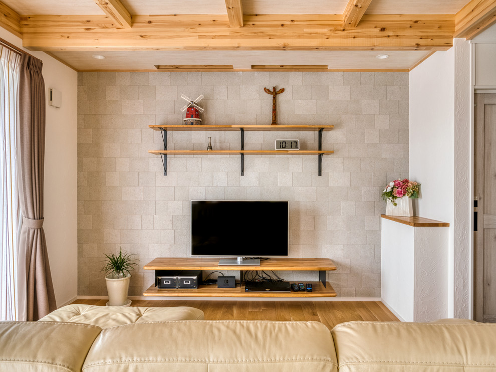 Living room - large country open concept medium tone wood floor and brown floor living room idea in Other with gray walls and a tv stand