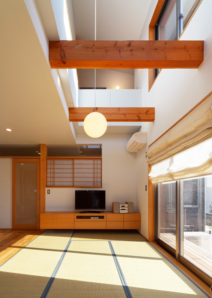 World-inspired living room in Other with white walls and tatami flooring.