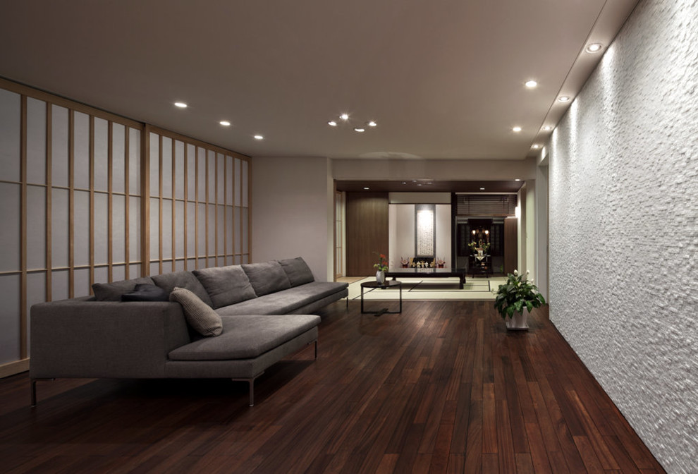 Living room - modern dark wood floor living room idea in Fukuoka with white walls