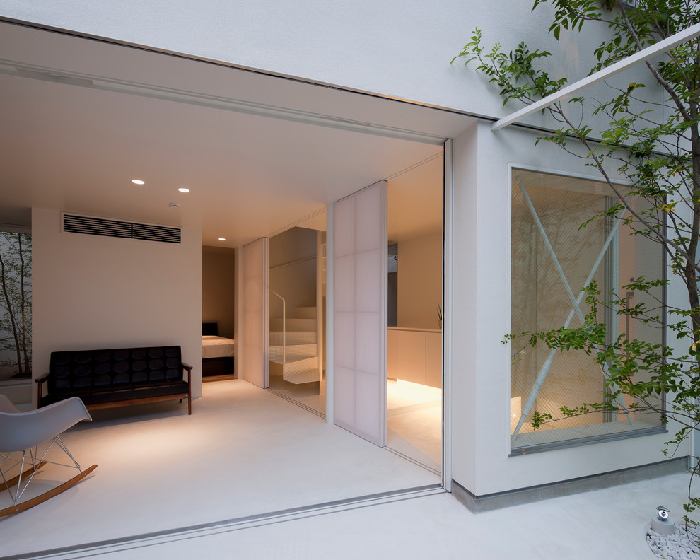 Ispirazione per un soggiorno moderno con pareti bianche