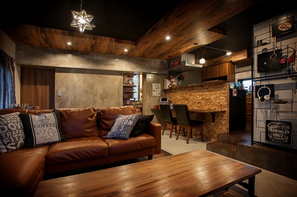 Example of an urban open concept living room design in Fukuoka with gray walls