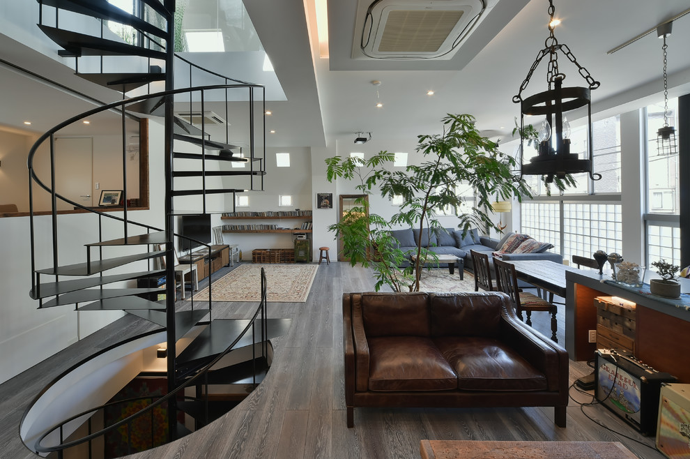 Living room - large industrial open concept living room idea in Tokyo with a bar