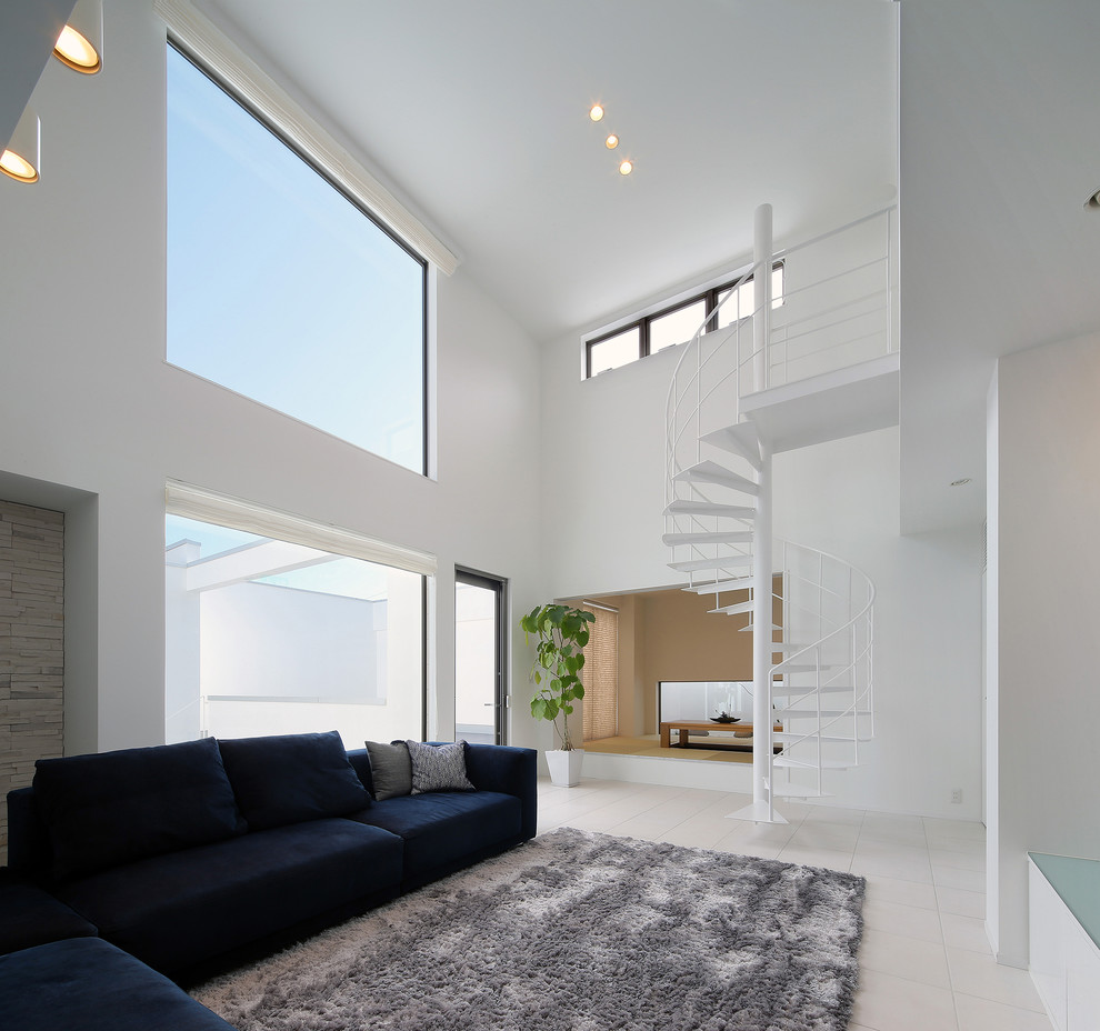 Example of a minimalist white floor living room design with white walls