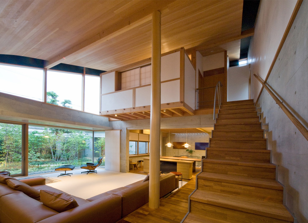 Living room - zen medium tone wood floor and brown floor living room idea in Kyoto with gray walls and no tv