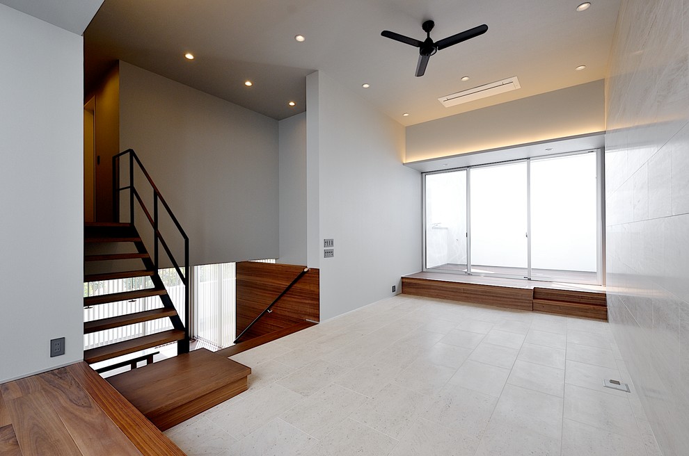 This is an example of a modern mezzanine living room in Tokyo Suburbs with white walls, limestone flooring, no fireplace and white floors.