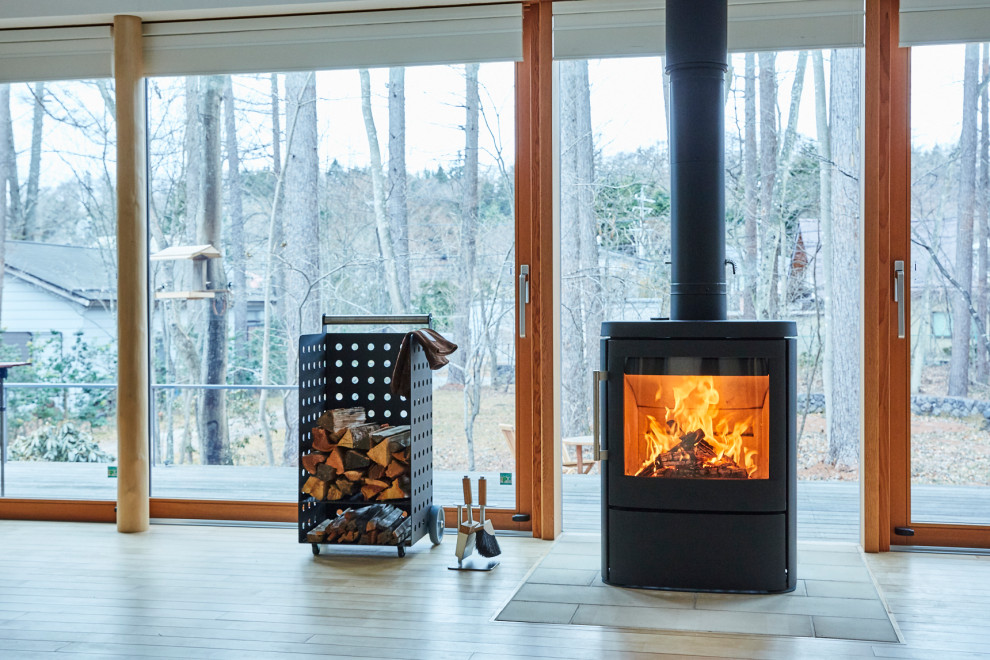 Photo of a large scandi living room in Other with a wood burning stove and a tiled fireplace surround.