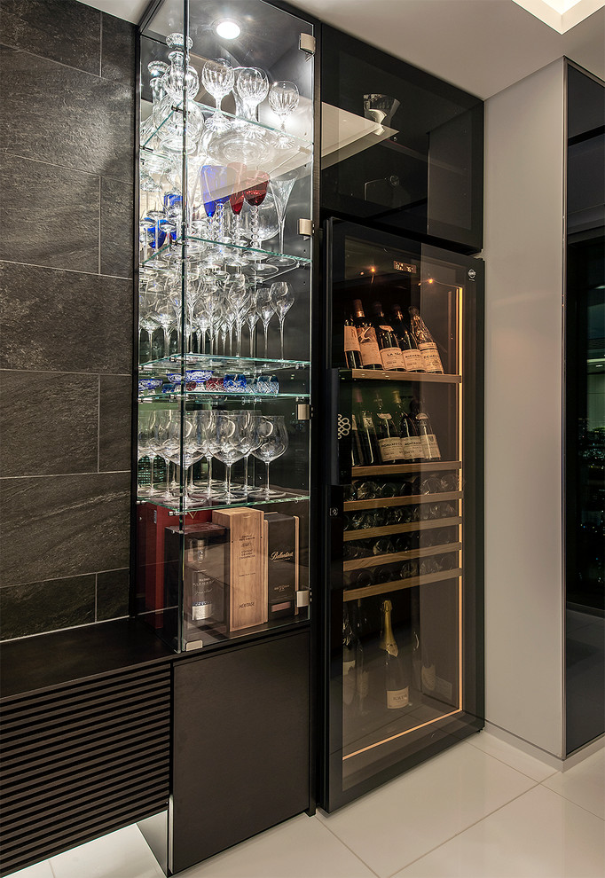 This is an example of a modern wine cellar with display racks and white floors.