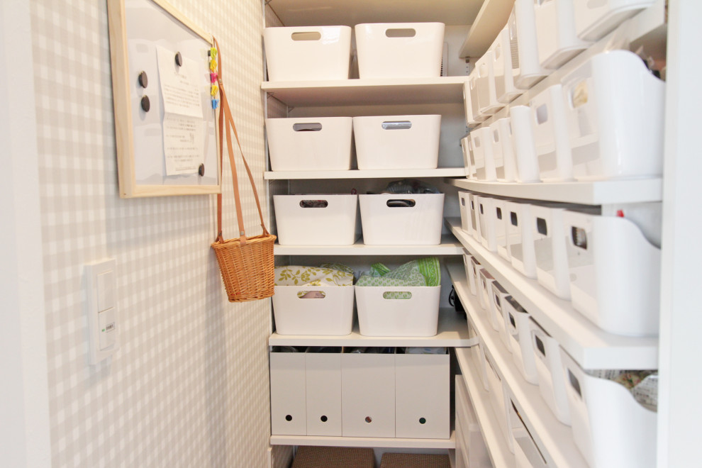 Inspiration for a medium sized scandinavian gender neutral walk-in wardrobe in Tokyo Suburbs with open cabinets, white cabinets, medium hardwood flooring and brown floors.