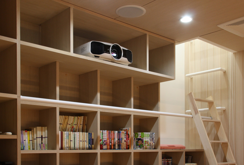 Example of a look-out light wood floor and beige floor basement design in Tokyo with a home theater and white walls