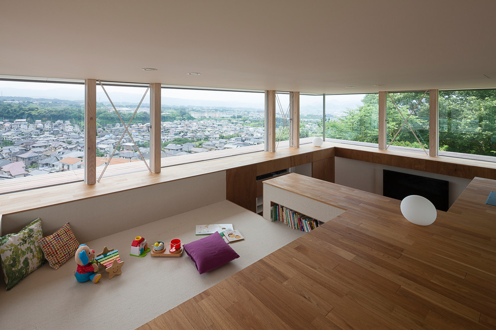 Example of a zen carpeted and brown floor kids' room design in Other