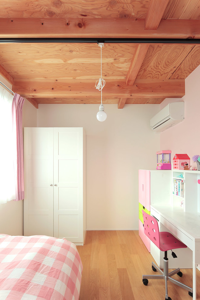 Kids' study room - farmhouse medium tone wood floor kids' study room idea in Other