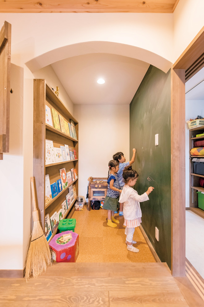 Kids' room - zen cork floor and brown floor kids' room idea in Other