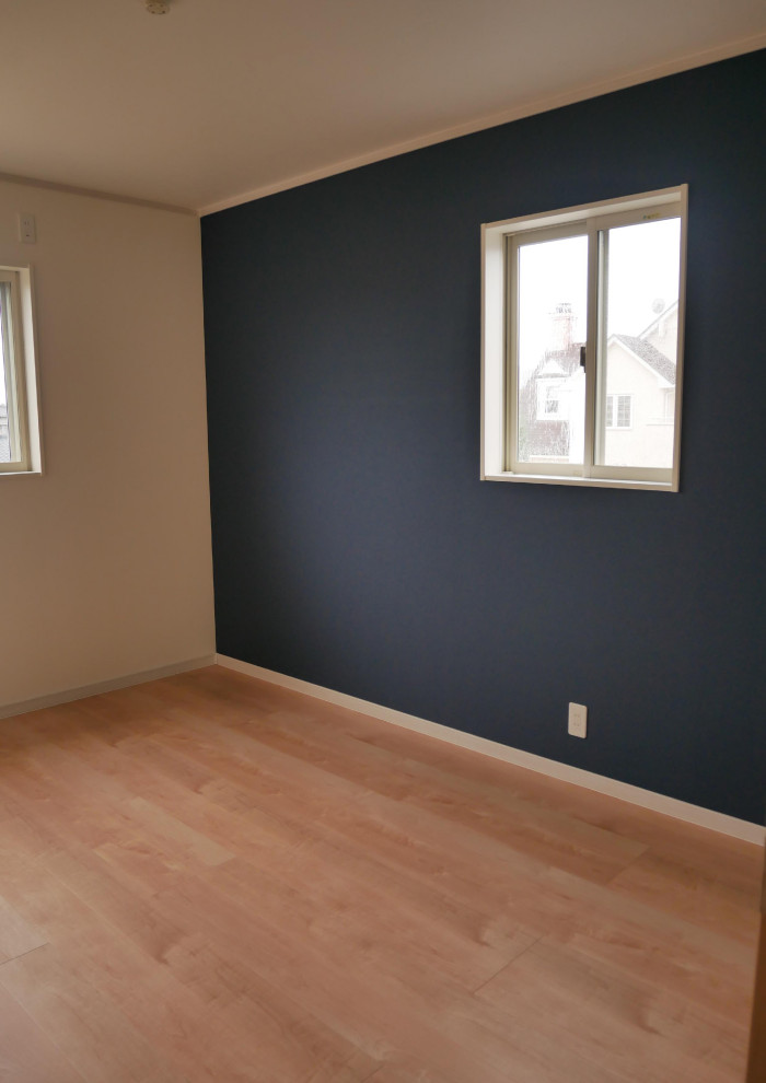 Kids' room - mid-sized scandinavian boy plywood floor and brown floor kids' room idea in Other with blue walls