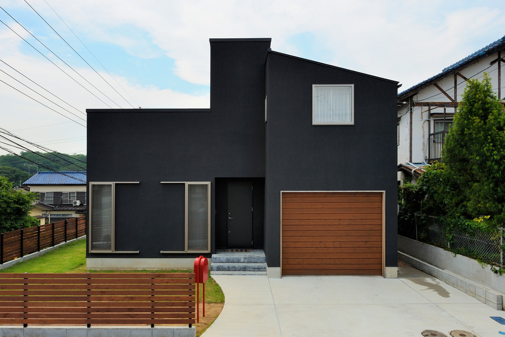 Idéer för ett rustikt svart hus, med två våningar och pulpettak