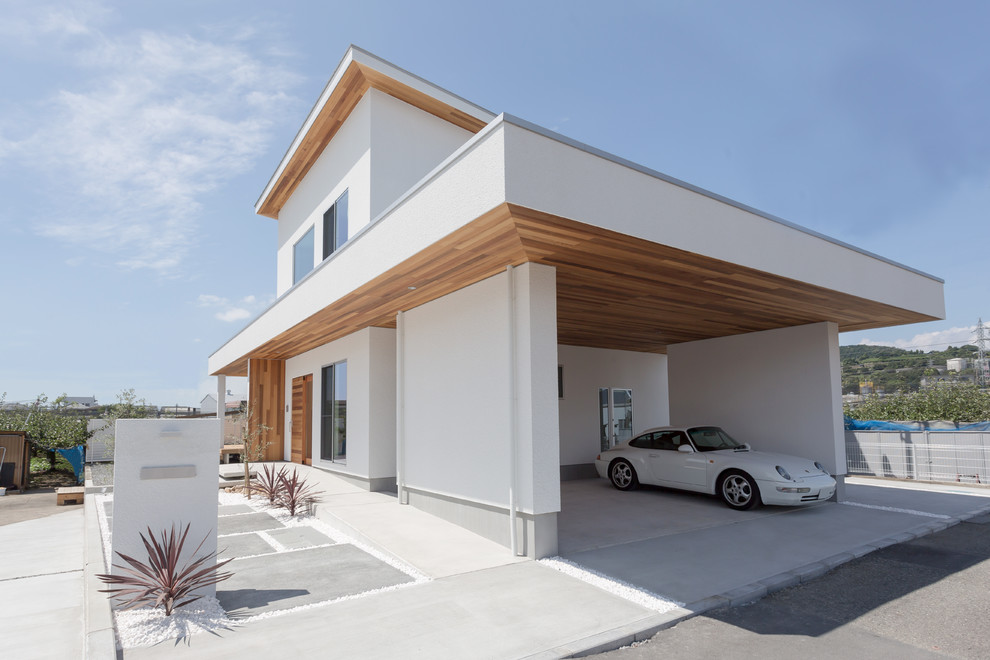 White scandi house exterior in Other with a flat roof.