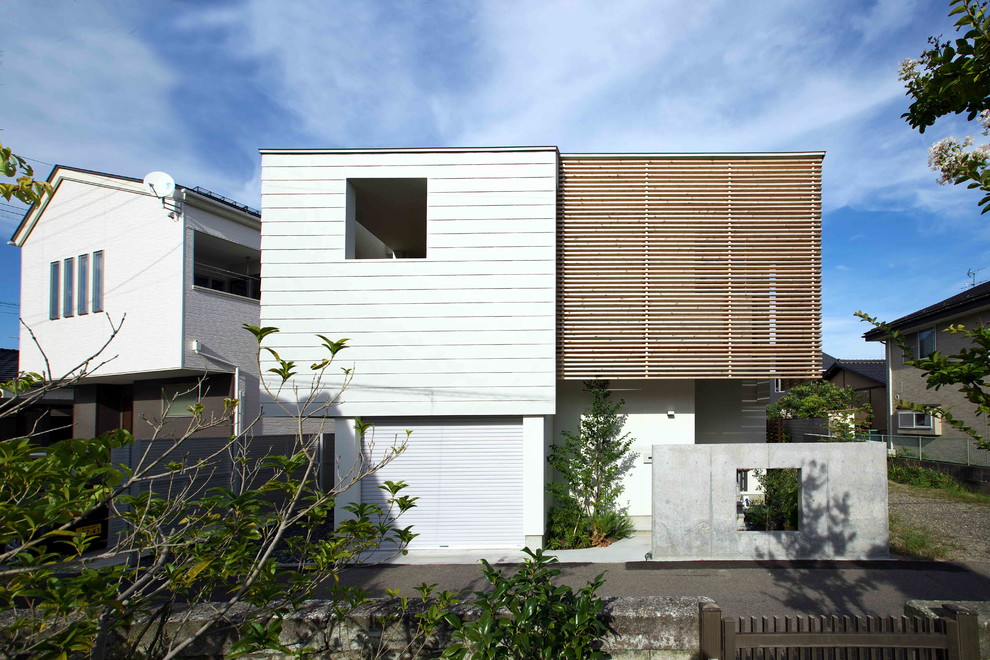 Ispirazione per la facciata di una casa bianca moderna con tetto piano
