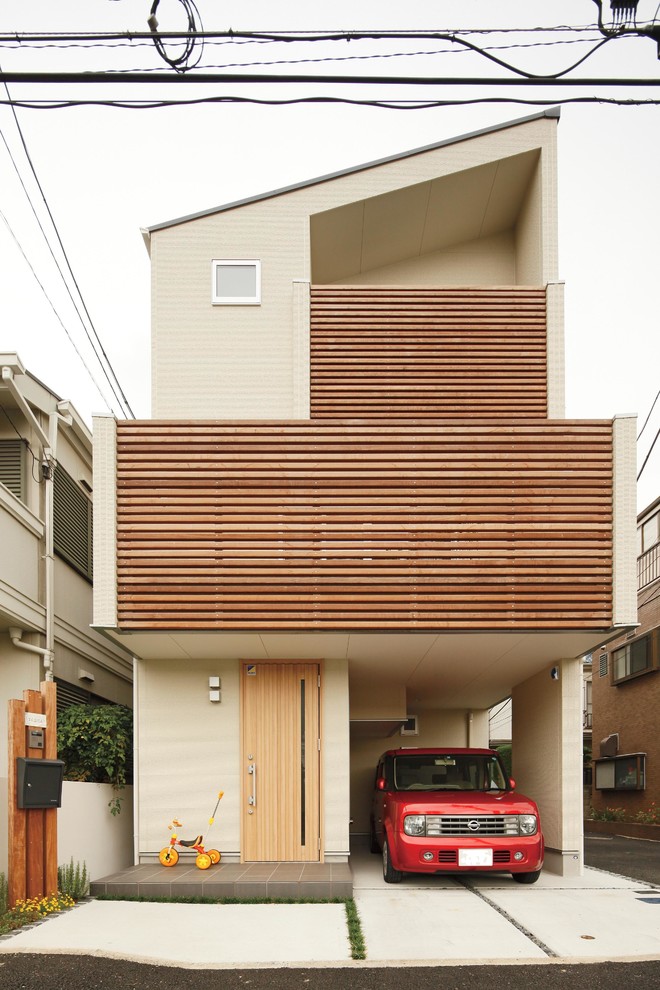 Modernes Haus mit beiger Fassadenfarbe und Pultdach in Sonstige