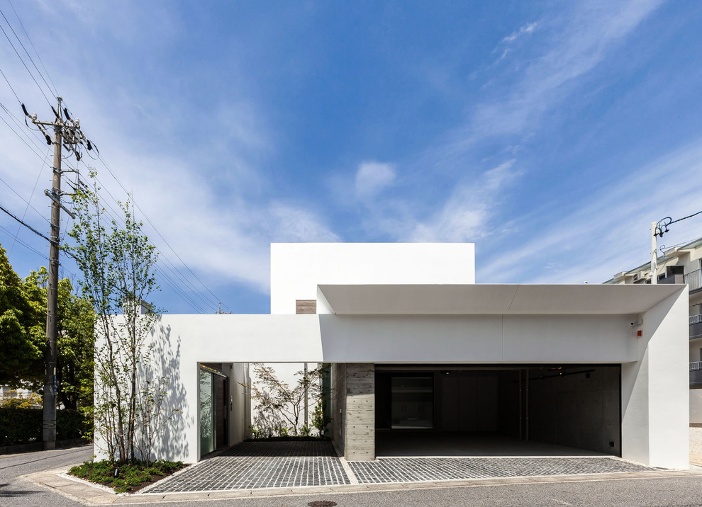 Ejemplo de fachada de casa blanca minimalista grande de dos plantas