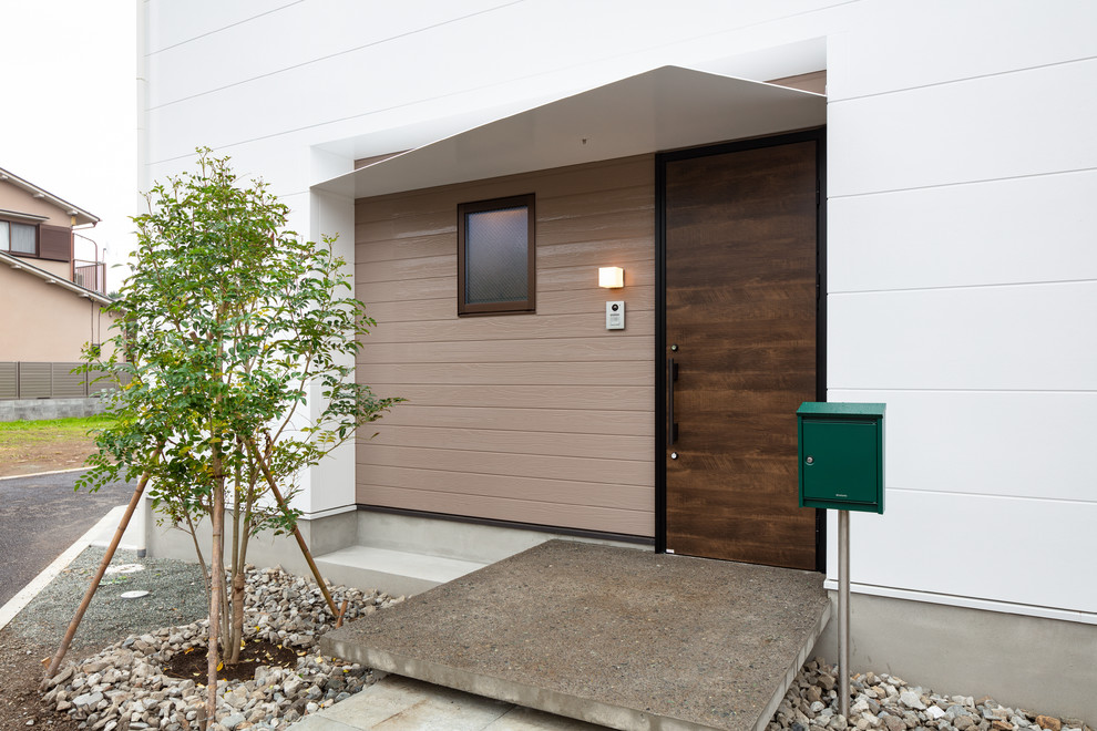 This is an example of a small modern house exterior in Other.