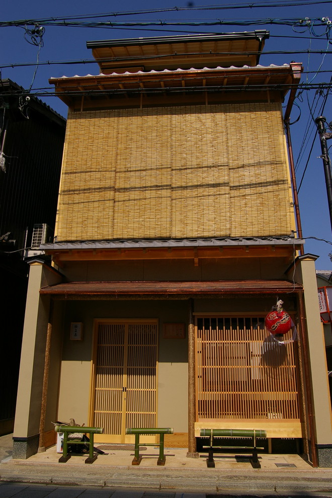 Inspiration for an asian beige two-story exterior home remodel in Kyoto