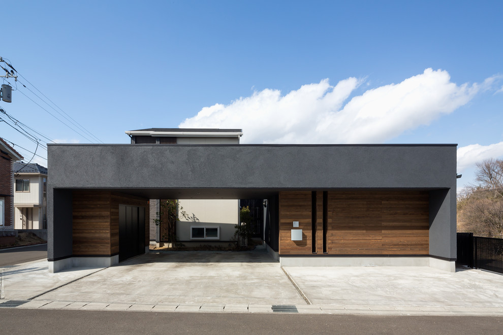Modelo de fachada de casa negra asiática con tejado plano