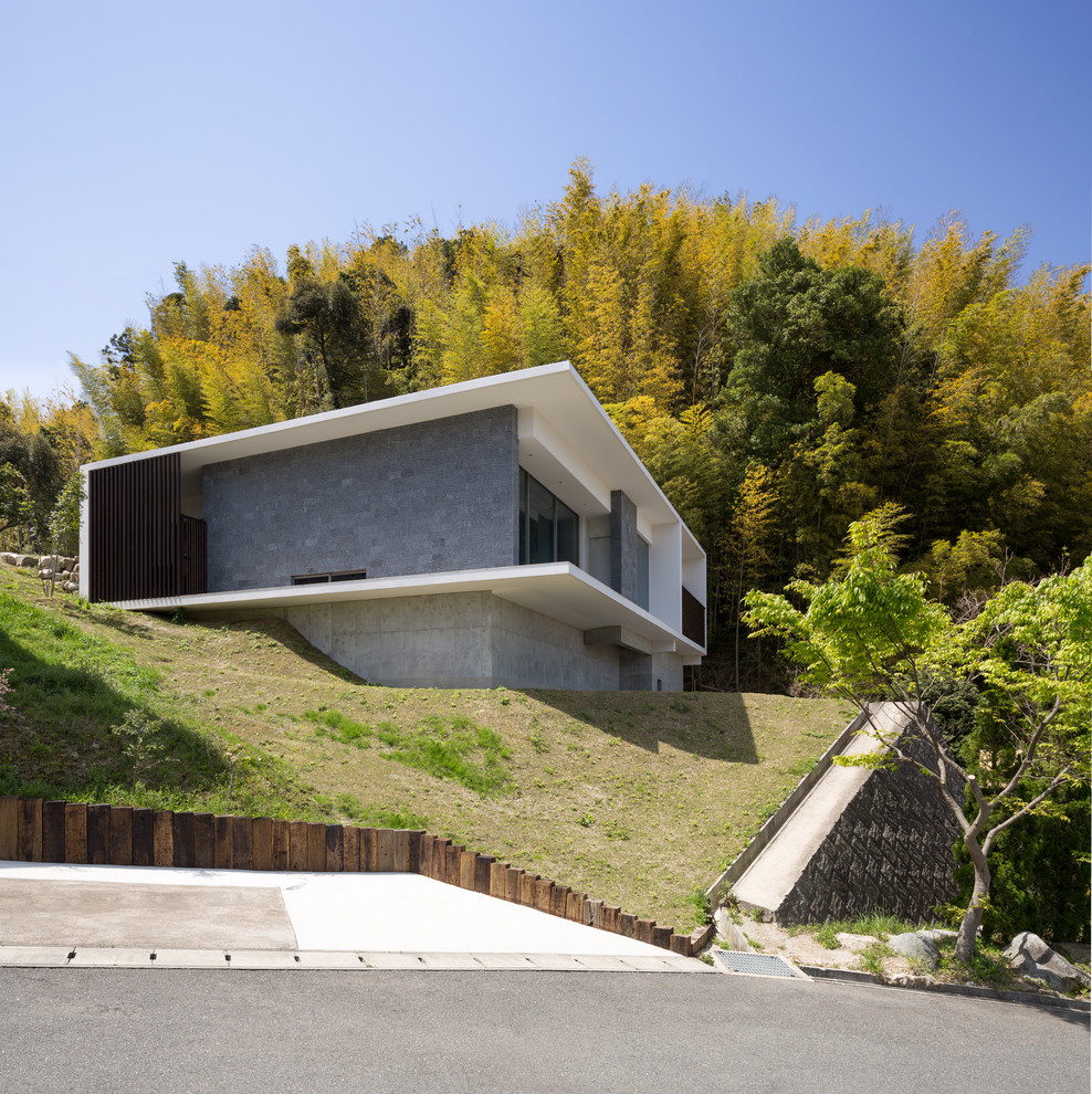 福岡にあるコンテンポラリースタイルのおしゃれな家の外観 (混合材サイディング) の写真