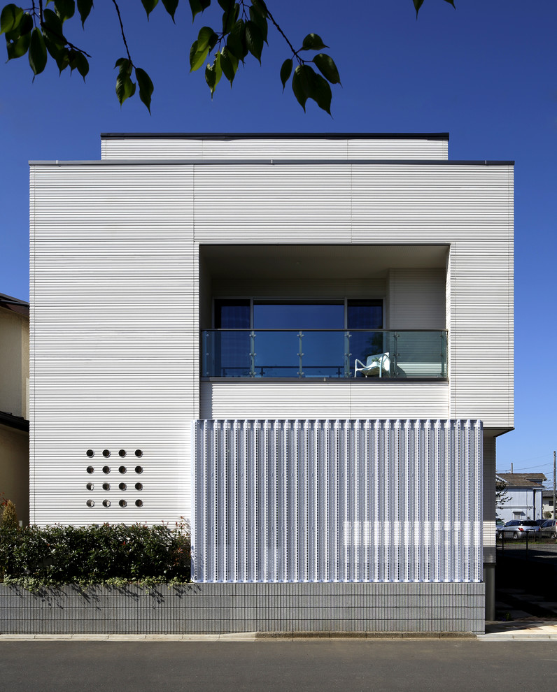 This is an example of a contemporary two floor detached house in Other.