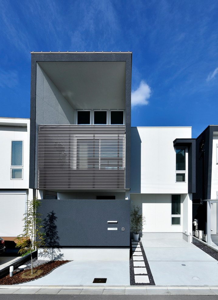 Modelo de fachada de casa negra moderna de dos plantas con revestimientos combinados, tejado de un solo tendido y tejado de metal