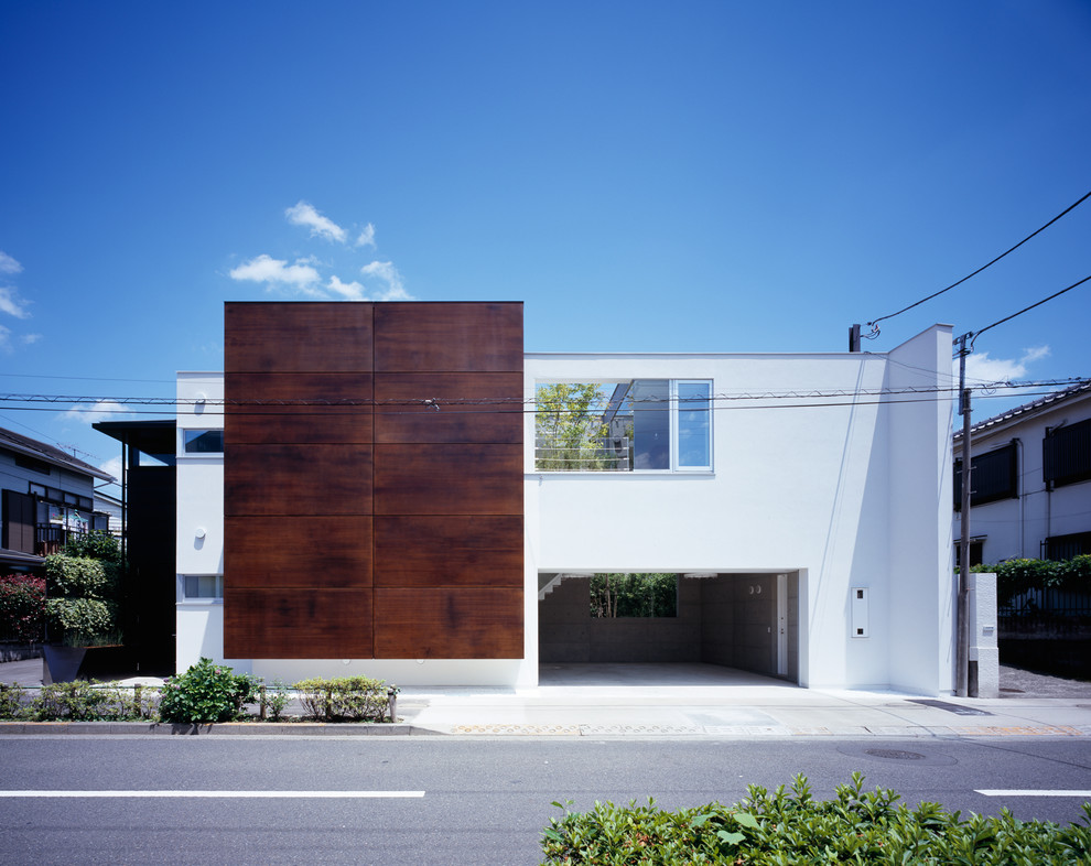 Свежая идея для дизайна: белый дом в стиле модернизм с плоской крышей - отличное фото интерьера