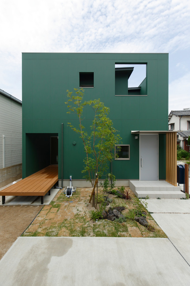 Foto på ett funkis grönt hus