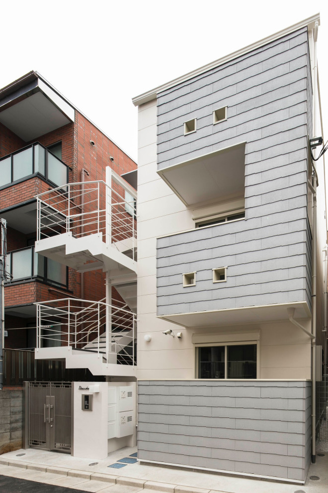 東京23区にあるお手頃価格の小さな北欧スタイルのおしゃれな家の外観 (コンクリート繊維板サイディング) の写真
