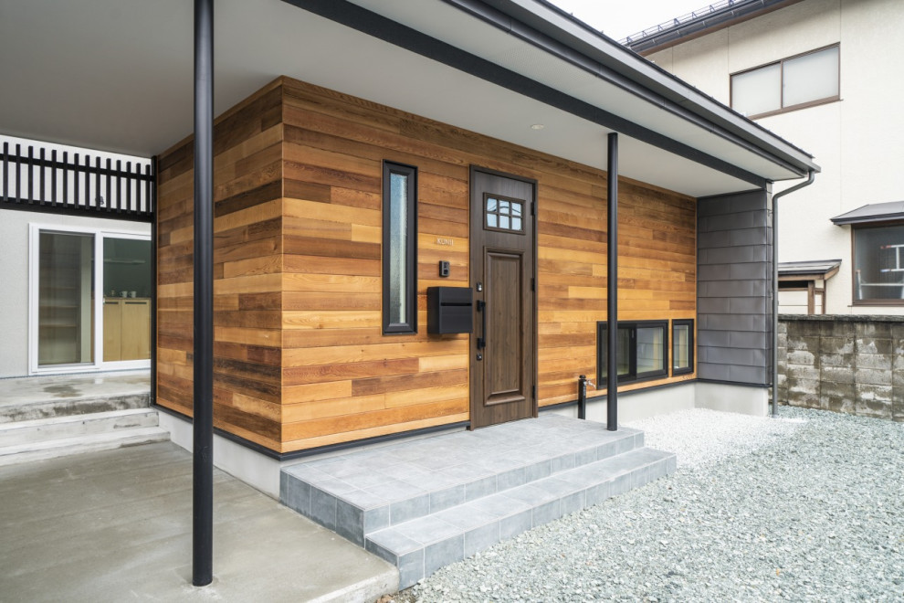 Idéer för ett mellanstort modernt flerfärgat hus, med två våningar, fiberplattor i betong, pulpettak och tak i metall