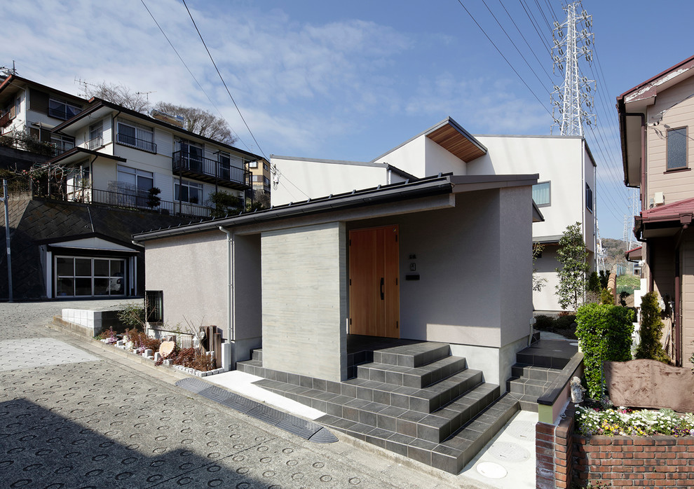 Diseño de fachada de casa gris minimalista