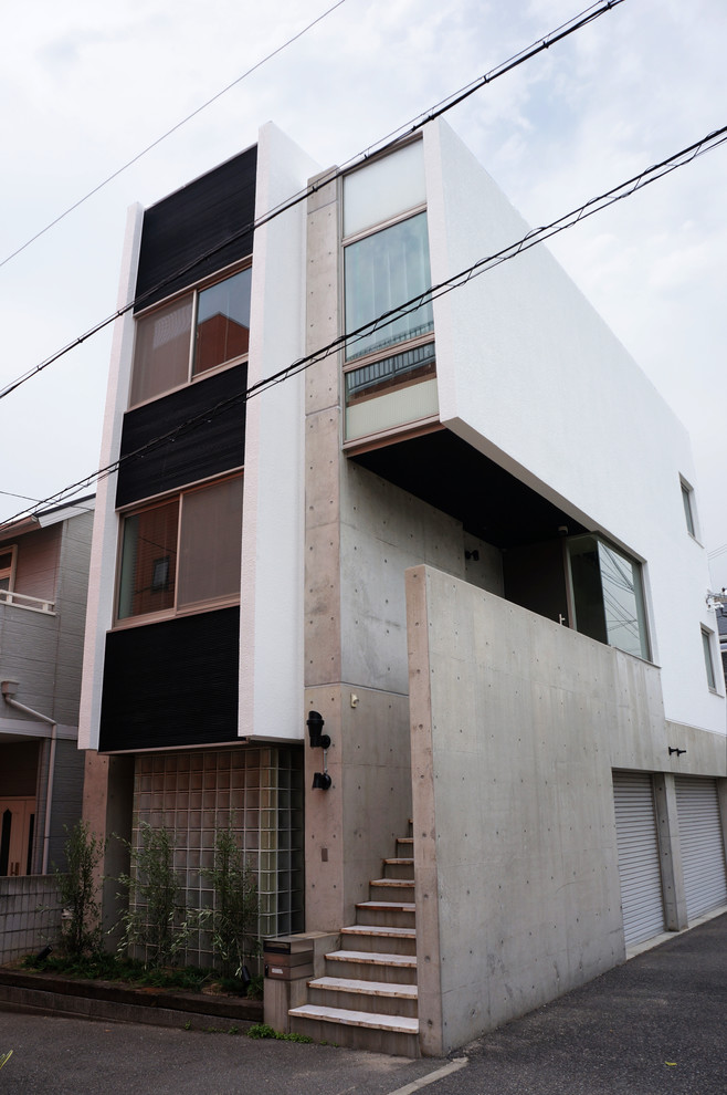 Example of an urban exterior home design in Osaka